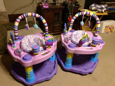 pink and purple excersaucers for twin girls