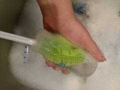 silicone bottle brush cleaning a bottle